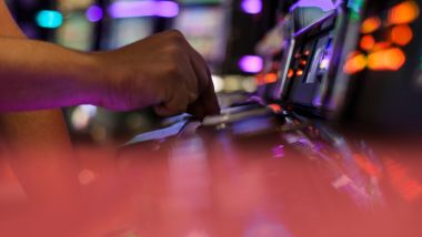 Guest playing slot machine