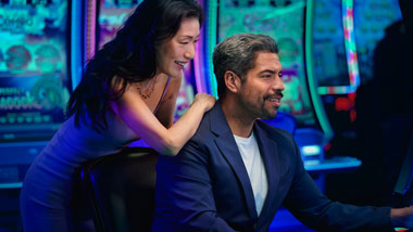 Guy and girl on a slot machine